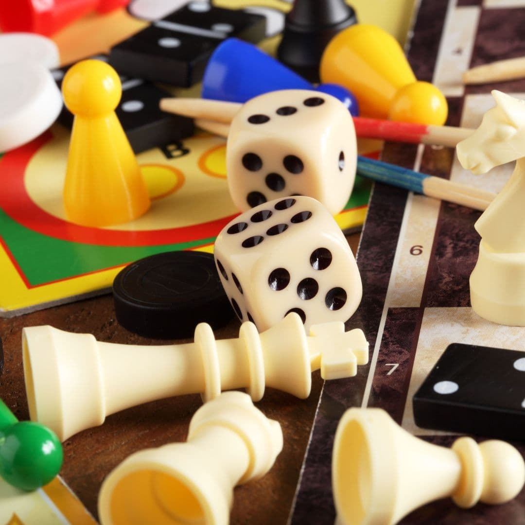 Carrom board set up with black and white pieces